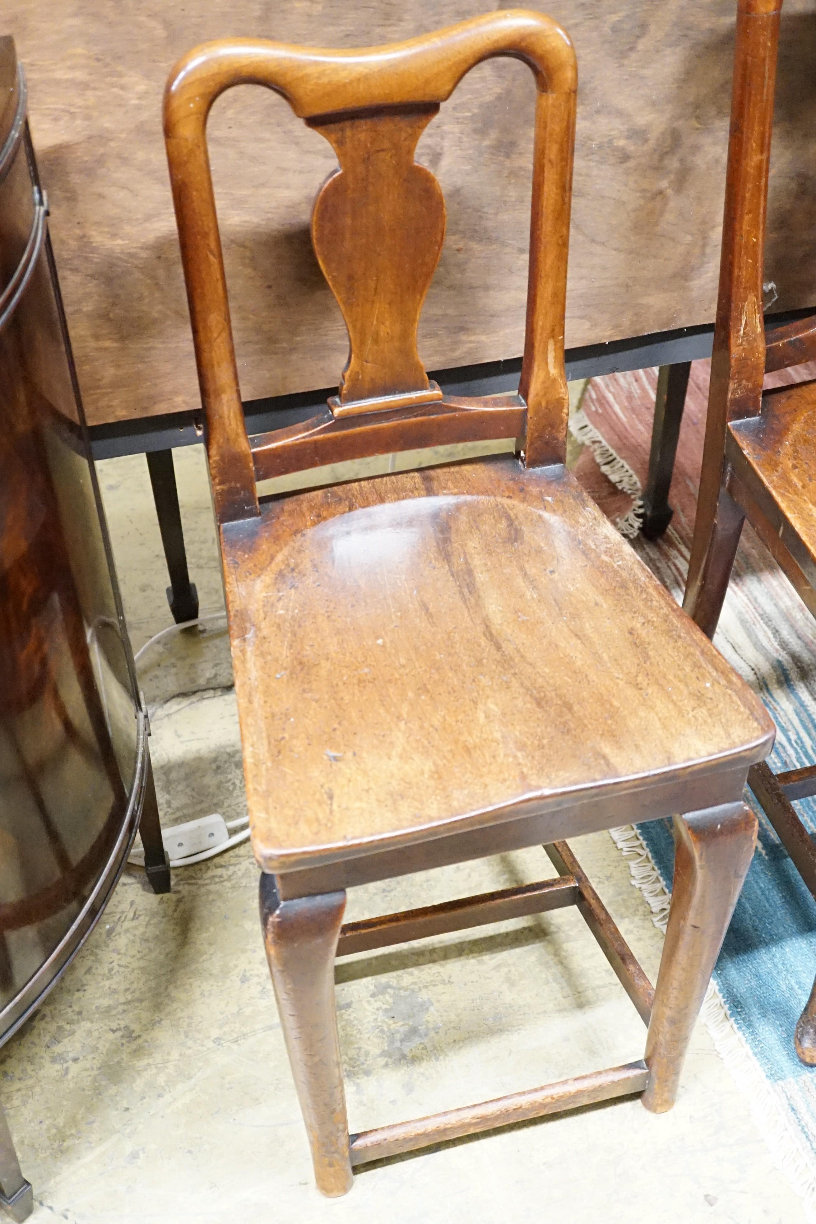 A pair of mahogany hall chairs, (one cut down)